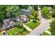 An aerial view highlights the home's curb appeal, lush lawn and mature landscaping at 176 Rockyford Ne Rd, Atlanta, GA 30317