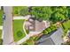 An aerial view shows the residence, green lawn, mature trees and landscaping at 176 Rockyford Ne Rd, Atlanta, GA 30317