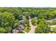 Elevated view displaying the residences nestled amongst the lush green trees in the neighborhood at 176 Rockyford Ne Rd, Atlanta, GA 30317