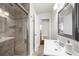 Bathroom featuring a glass shower, vanity, and bright lighting at 176 Rockyford Ne Rd, Atlanta, GA 30317