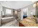 Bathroom offers a tub, walk-in shower, dual sinks with granite counters, and linen closet at 176 Rockyford Ne Rd, Atlanta, GA 30317