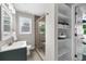 Bathroom with a sink, walk in shower, and storage shelves at 176 Rockyford Ne Rd, Atlanta, GA 30317