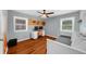 Well-lit bedroom featuring hardwood floors, a daybed, and built-in desk at 176 Rockyford Ne Rd, Atlanta, GA 30317