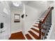Entryway featuring a staircase with dark stained wood and a 'Welcome to Kirkwood' sign at 176 Rockyford Ne Rd, Atlanta, GA 30317