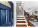 Entryway featuring a staircase with dark stained wood and an inviting living room visible in the background at 176 Rockyford Ne Rd, Atlanta, GA 30317