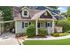 Charming exterior of a well-maintained home with a covered carport, inviting front porch, and manicured lawn at 176 Rockyford Ne Rd, Atlanta, GA 30317