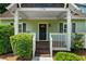 Inviting front porch with dark-stained wood and white railings, perfect for relaxing at 176 Rockyford Ne Rd, Atlanta, GA 30317