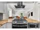 Open concept kitchen featuring stainless appliances and views into the living room at 176 Rockyford Ne Rd, Atlanta, GA 30317