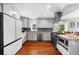 Spacious kitchen with modern appliances, wooden floors, and ample counter space at 176 Rockyford Ne Rd, Atlanta, GA 30317