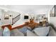Open living area with hardwood floors, modern furnishings, and staircase access at 176 Rockyford Ne Rd, Atlanta, GA 30317
