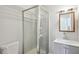 Bathroom featuring a shower stall, gray vanity with a white sink, and a framed mirror at 3611 Radcliffe Blvd, Decatur, GA 30034