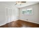 Bright bedroom features hardwood floors and closet with shutter doors at 3611 Radcliffe Blvd, Decatur, GA 30034
