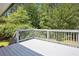 Gray painted deck surrounded by lush greenery at 3611 Radcliffe Blvd, Decatur, GA 30034