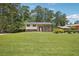Charming brick home showcasing a well-maintained lawn, mature trees, and classic architectural details at 3611 Radcliffe Blvd, Decatur, GA 30034