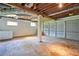 Unfinished garage with concrete floor, white walls, and a large two-car garage door at 3611 Radcliffe Blvd, Decatur, GA 30034