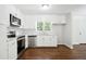 Modern kitchen featuring white cabinets, stainless steel appliances, and sleek countertops at 3611 Radcliffe Blvd, Decatur, GA 30034