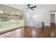 Open-concept living room featuring hardwood floors, large windows with natural light, and stylish decor at 3611 Radcliffe Blvd, Decatur, GA 30034