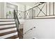 Staircase showcasing iron railing and contrasting wood and white finishes at 3611 Radcliffe Blvd, Decatur, GA 30034