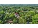 Overhead view of the home nestled in a verdant, wooded area, providing a sense of privacy and natural beauty at 587 Woods Nw Dr, Atlanta, GA 30318