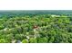 Aerial view of a charming home surrounded by beautiful, mature trees, offering a secluded and serene setting at 587 Woods Nw Dr, Atlanta, GA 30318