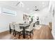 Bright dining area featuring hardwood floors and flows seamlessly to the living room at 587 Woods Nw Dr, Atlanta, GA 30318