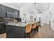 Bright kitchen with a modern island, stainless steel appliances, and an open layout at 587 Woods Nw Dr, Atlanta, GA 30318