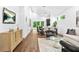 Bright, open living space with high ceilings, hardwood floors, and modern furnishings at 587 Woods Nw Dr, Atlanta, GA 30318