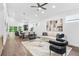 Open-concept living area boasts hardwood floors, recessed lighting, and contemporary decor at 587 Woods Nw Dr, Atlanta, GA 30318