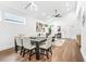 Living room and dining area with hardwood floors, high ceilings, recessed lighting, and many windows at 587 Woods Nw Dr, Atlanta, GA 30318