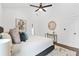 Comfortable main bedroom with high ceilings, ceiling fan, carpet, and modern decor at 587 Woods Nw Dr, Atlanta, GA 30318