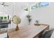 Close-up of a modern wood desk in an office with white walls and a view into the living area at 587 Woods Nw Dr, Atlanta, GA 30318