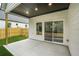 Covered patio featuring recessed lighting and sliding glass doors leading inside at 587 Woods Nw Dr, Atlanta, GA 30318