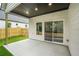 Covered patio featuring recessed lighting and sliding glass doors leading inside at 587 Woods Nw Dr, Atlanta, GA 30318