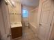 Well-lit bathroom with a single sink vanity and shower-tub combo at 2295 Eagle Pointe Ct, Lawrenceville, GA 30044