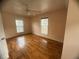 Bright bedroom featuring hardwood floors and windows offering natural light at 2295 Eagle Pointe Ct, Lawrenceville, GA 30044