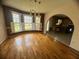 Bright dining room featuring hardwood floors and a bay window overlooking the yard at 2295 Eagle Pointe Ct, Lawrenceville, GA 30044