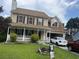 Charming two-story home featuring a welcoming front porch and attached garage at 2295 Eagle Pointe Ct, Lawrenceville, GA 30044