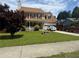 Traditional two-story home featuring a well-manicured lawn and welcoming front porch at 2295 Eagle Pointe Ct, Lawrenceville, GA 30044