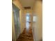 Hallway with hardwood floors, leading to the bathroom and bedroom at 2295 Eagle Pointe Ct, Lawrenceville, GA 30044