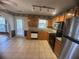 Well-appointed kitchen with granite counters, tile floor, and stainless steel appliances at 2295 Eagle Pointe Ct, Lawrenceville, GA 30044