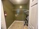 Spacious laundry room includes shelving for storage at 2295 Eagle Pointe Ct, Lawrenceville, GA 30044