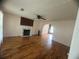 Cozy living room with hardwood floors and a fireplace, perfect for relaxing at 2295 Eagle Pointe Ct, Lawrenceville, GA 30044