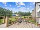 Inviting wooden deck with outdoor seating. Surrounded by beautiful landscaping and trees at 2755 Evan Manor Ln, Cumming, GA 30041