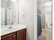 Bathroom featuring a modern vanity and a shower-tub combination with a gray curtain at 2755 Evan Manor Ln, Cumming, GA 30041