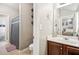 Well-lit bathroom featuring a combination toilet and shower at 2755 Evan Manor Ln, Cumming, GA 30041
