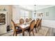 Elegant dining room featuring modern paint colors, gray vinyl floors, and white trim at 2755 Evan Manor Ln, Cumming, GA 30041