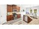 Open kitchen showcasing granite counters, stainless steel appliances, and wood cabinets at 2755 Evan Manor Ln, Cumming, GA 30041