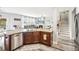 Well-lit kitchen offers granite countertops, stainless steel appliances, and seamless connectivity to the living room at 2755 Evan Manor Ln, Cumming, GA 30041