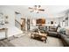 Bright and airy living room featuring an open floor plan, modern floors, and a cozy sectional sofa at 2755 Evan Manor Ln, Cumming, GA 30041