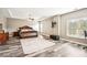 Expansive main bedroom boasts tray ceiling and large windows, creating a serene retreat at 2755 Evan Manor Ln, Cumming, GA 30041